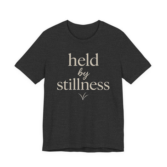 Held by Stillness — Minimal Text Graphic Tee